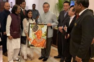M. R. Pimpare and Mayura present a piece of Ajanta art to Chinese foreign minister Wang Yi. Image courtesy of Mayura Pimpare